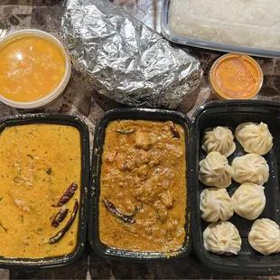 Chicken Momo, Chicken Chettinad, Goan Shrimp Curry, 2 Garlic Naan, Mango Mousse Cheesecake