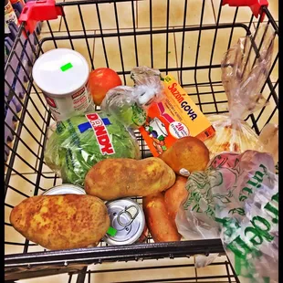 a shopping cart full of groceries