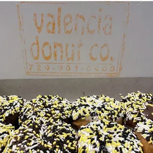 a box of chocolate and yellow sprinkles