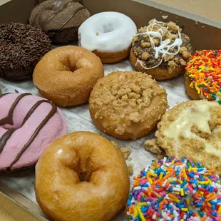 a variety of doughnuts in a box