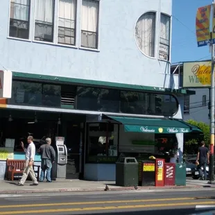 people walking on the sidewalk