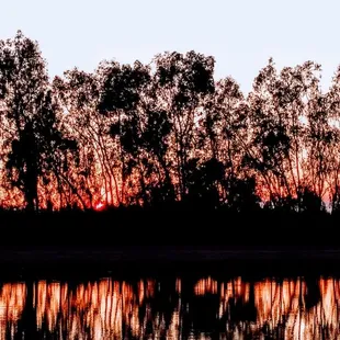 a sunset over a lake