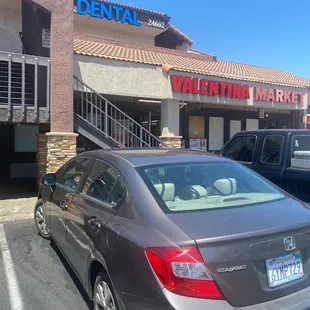 a car parked in front of a store