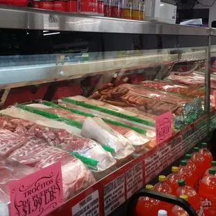a display of meat and drinks