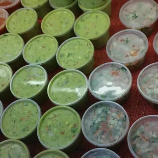a variety of soups in plastic containers