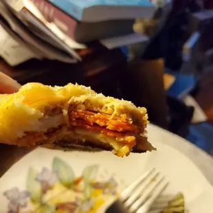 Inside bite view of the sausage,bacon and pepperoni calzone. Loaded eh?