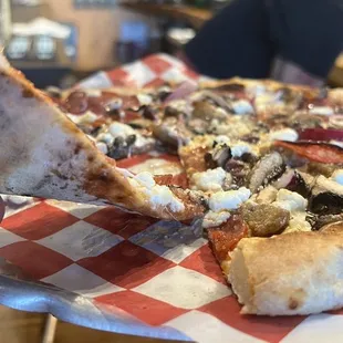 Thin crust! Delicious toppings! Fire baked in that brick oven!