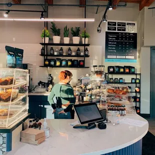 a woman working behind the counter