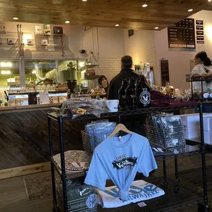 a couple of people standing in front of a counter