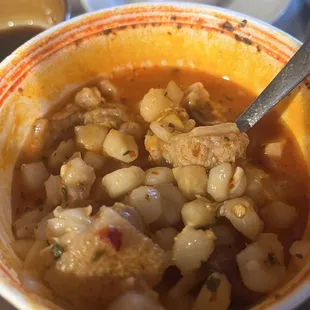 a bowl of soup with a spoon in it
