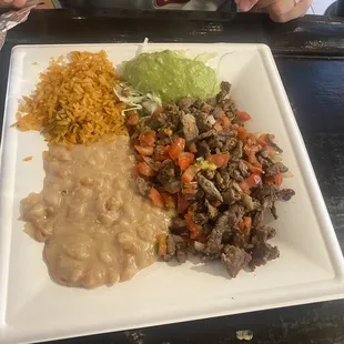 Carne asada plate with rice and beans