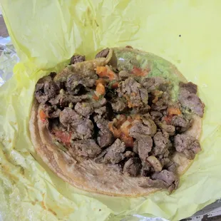 carne asada taco.  one of these is enough if you want a bite while not being too stuffed.  meat seasoned very well.