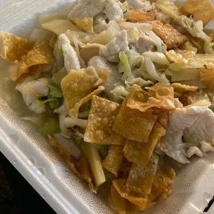 a chicken salad in a styrofoam container