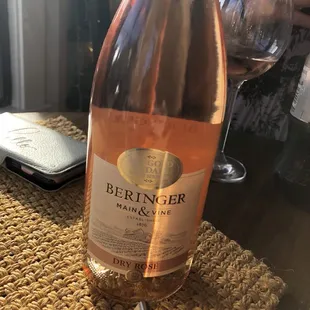 a glass of wine and a bottle of wine