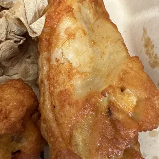 a close up of a piece of fried food