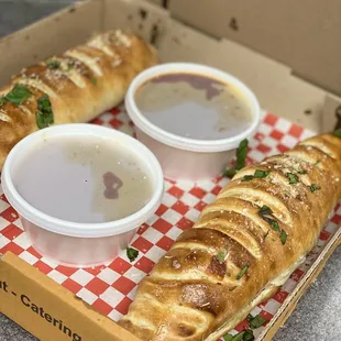 a box of bread with dippings