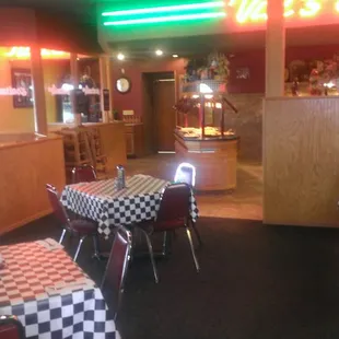a restaurant with checkered tables and chairs