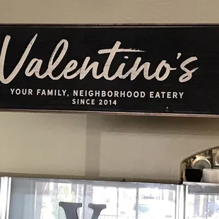 The Signature Signage inside separating the dining area from the kitchen and wait station.