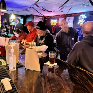 people sitting at the bar