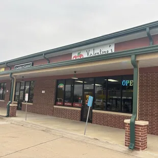 One side from outside, diagonal to the antique store