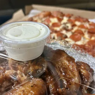 BBQ Chicken Dinner with a Large Pepperoni and Sausage Pizza   BBQ Wings are a 10/10 recommend!