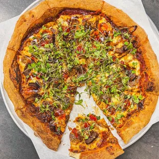 Sausage and fig pizza with micro greens