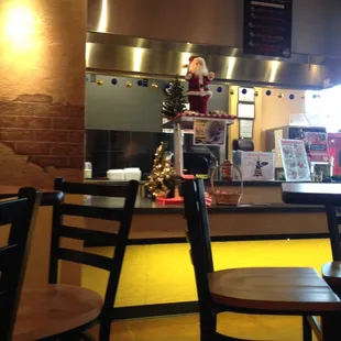 a restaurant counter and chairs