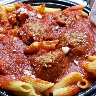 a bowl of pasta and meatballs
