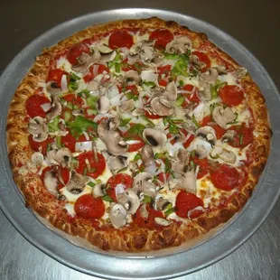 a pizza with mushrooms and peppers