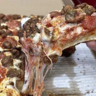 Detroit style pie with pepperoni and sausage