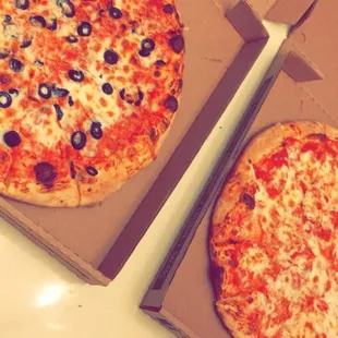 Most delicious pizza ever! Best part is, got these both large pizzas for just $12!