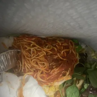 a salad and spaghetti