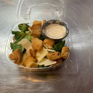 a salad in a plastic container