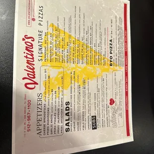 a piece of pizza on a plastic bag