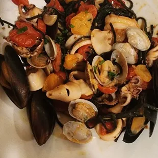 TTAGLIOLINI SORRENTO A mix of &quot;Nero di Seppia&quot;(squid ink) tossed with baby clams, calamari, mussels, &amp; shrimp.