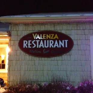 the front of the restaurant at night