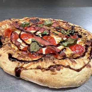 The Fig &amp; Prosciutto with a balsamic glaze on a Hand Toss Crust.