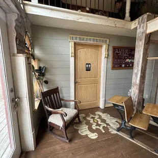 Cute Little Library Loft nook above Bathroom