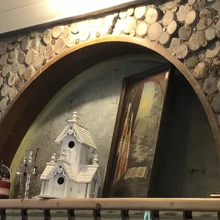 The archway is logs and shot gun shells, so so cool.