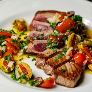 Bluefin Tuna Siciliano sustainably and wild caught Bluefin tuna from the coast of Maine served with a Sicilian style salsa.