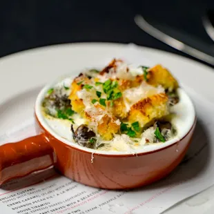 Escargot- Burgundy snails, Parsley garlic butter, croutons, parmigiano cheese. (can be GF w/o croutons)