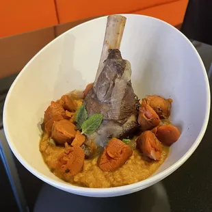Spice-rubbed braised lamb shank with cinnamon-spiced sweet potato puree and carrots