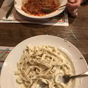 a plate of pasta and a fork