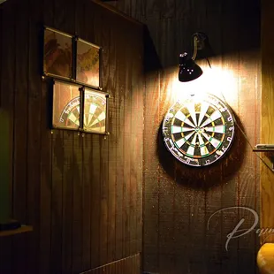 a dart in a target on a wall