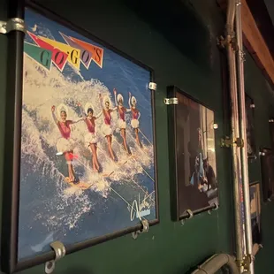 a group of surfers on a wave