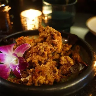 a bowl of food and a candle