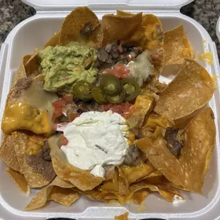 Asada nachos.  Only a few bites taken out.  My wife didn't care for the meat.