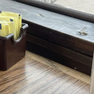 a cup of coffee on a window sill