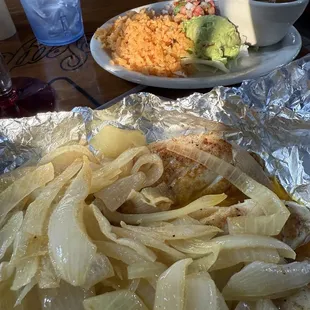 Grilled fish with guacamole, rice, soup