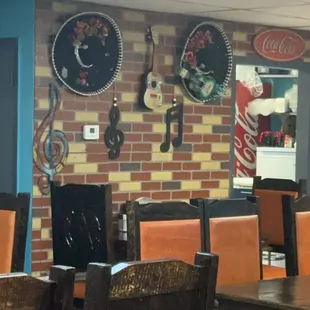 a brick wall with guitars on it